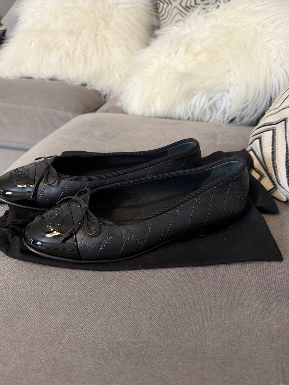 CHANEL Black Quilted Leather Cap-Toe Bow Ballet Flats